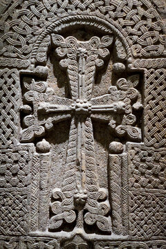 New York City, NY.  Old carved ornate cross in stone. 