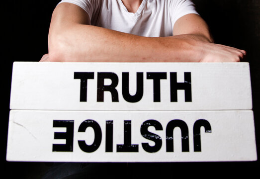 Santa Fe, New Mexico. Man with a sign about truth and justice