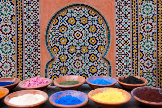 Marrakech, Morocco Clay bowls of spices and bluing with tile background.