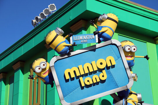 
Minion figures on a Minion Land poster