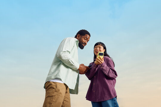 Man and woman use their phones