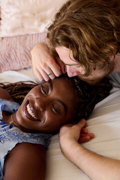 Couple sharing affectionate moment while resting