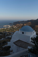 Fototapeta premium Aerial View of a Greek Island with White Wash Church