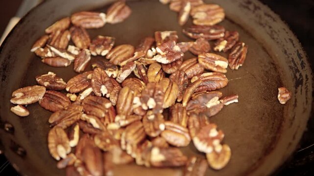 Pecan Nuts Roasting In Pan. Cooking Ingredients For Dessert. Healthy Vegan Food Nutrition