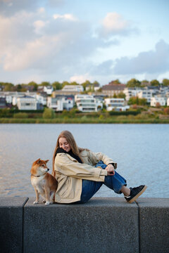 Woman and dog looking at each other