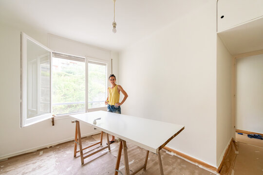 Smiling woman during new home renovation