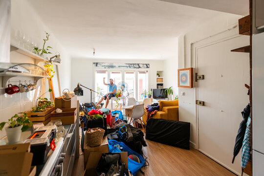 Cheerful Man Celebrating Moving Day Chaos