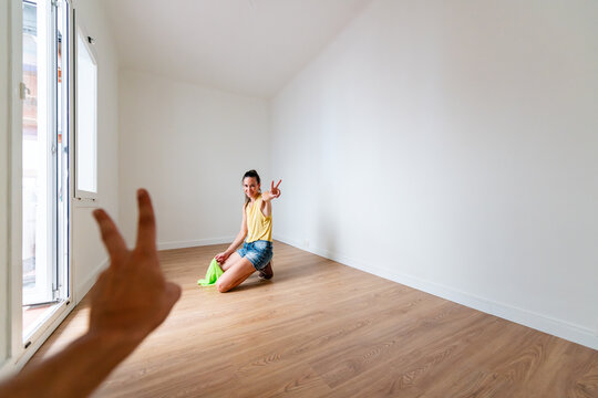 Playful couple portrait during new home moving