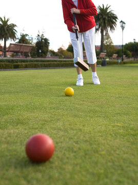 Senior Citizen Croquet Player yellow ball 