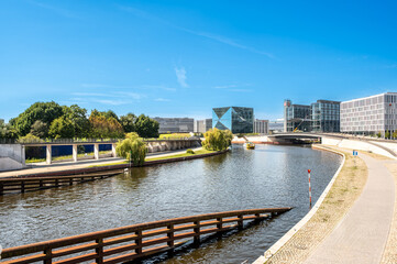Berlin, germany, august 15, 2023. Berlin cityscape featuring the spree river, waterfront buildings, and the contemporary architecture of cube berlin on a clear day © Massimo Parisi