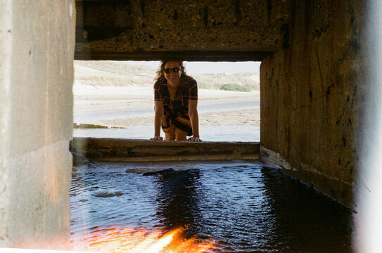 Portrait of a tourist framed by geometric architecture