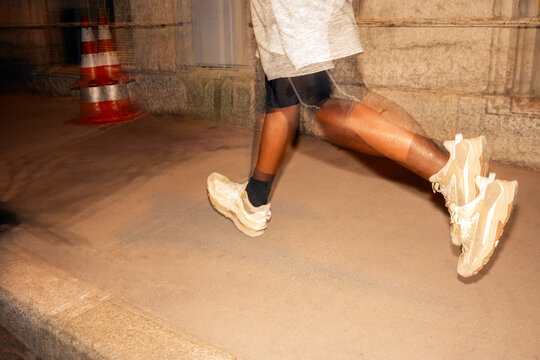 Runner Gains Speed on Urban Street During Night Exercise Session