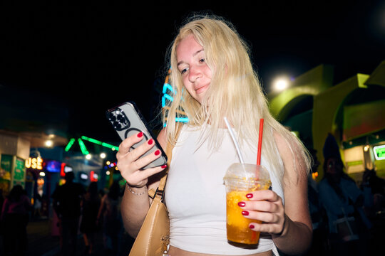 Blonde woman visits funfair