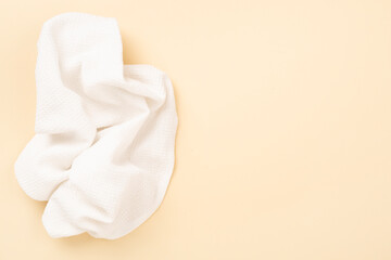 Kitchen napkin on color background, top view