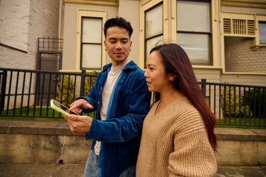 Couple is walking down the street