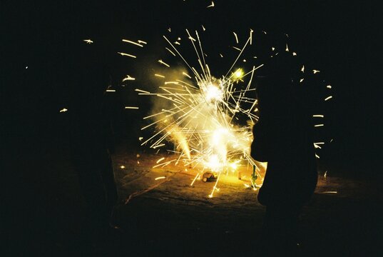 Firecrackers exploding at night