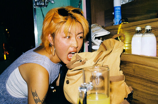 Orange short hair woman eating her backpack