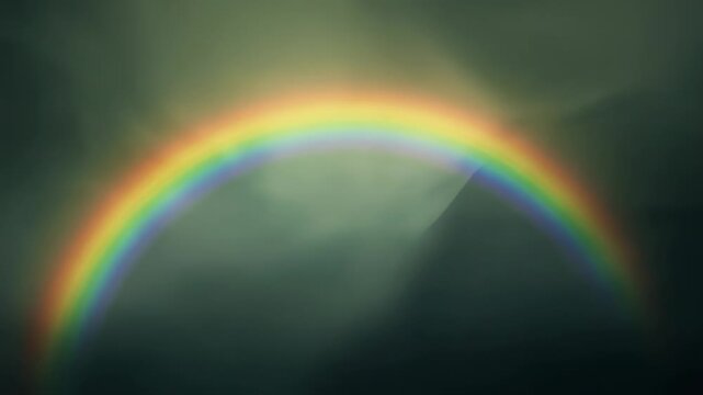 Arching semicircle rainbow holding across stormy sky, sunlight hitting rain creating colors