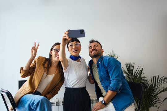 Three Happy Colleagues Taking a Selfie