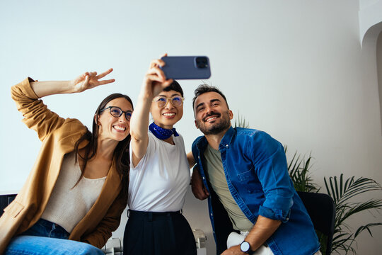Three Happy Colleagues Taking a Selfie