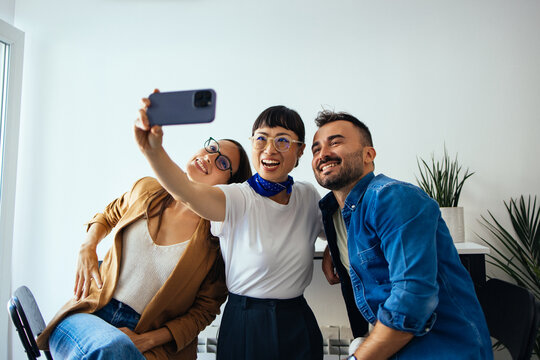 Three Happy Colleagues Taking a Selfie
