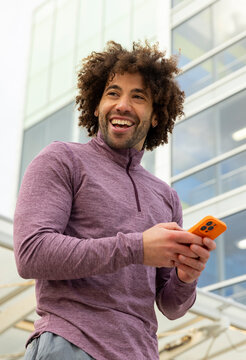 Casual  Portrait laugh black man cell phone outdoors 