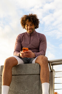 Casual  Portrait black guy cell phone texting