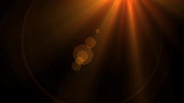 Warm orange light rays with soft lens flare and glowing bokeh on dark background cinematic sunlight effect animation