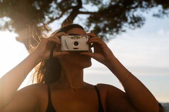 Capturing the Sunset With a Vintage Camera in Nature