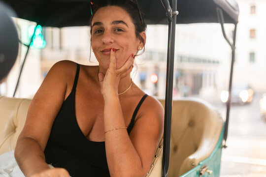 Smiling Woman in City Rickshaw