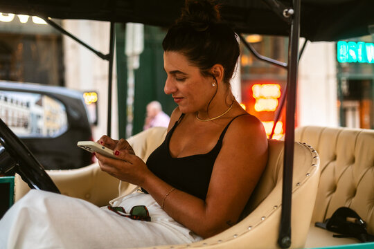 Texting Vintage Car Lively City Street