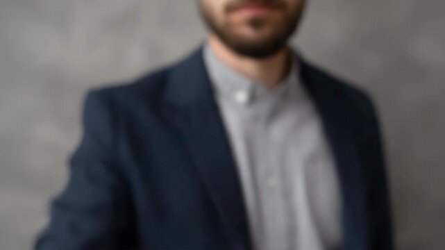 Confident young adult male clenched fist gesture in suit