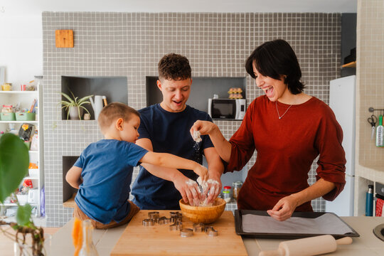 Family bakes holiday cookies
