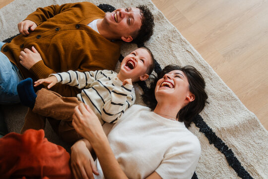 Family lies on the floor