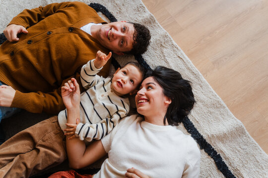 Happy family lies on the floor