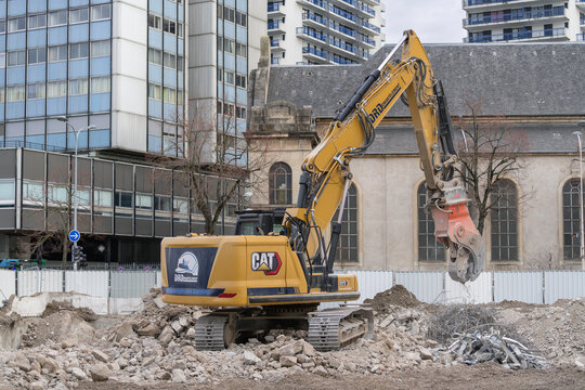 Nancy, France - January 13th 2026 : View on a crawler excavator CAT 323 for the demolition of a building on a construction site.