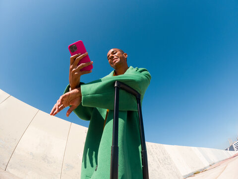 Traveler Checking Phone Clear Blue Sky