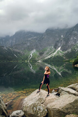 Woman enjoying Morskie Oko lake view in Tatra Mountains, Poland © WellStock