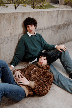 Two Friends Relax on a Sunny Day in an Urban Setting