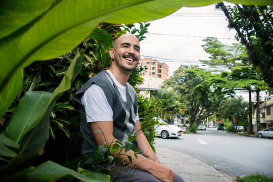 Man Enjoying a Day Surrounded by Greenery in the City