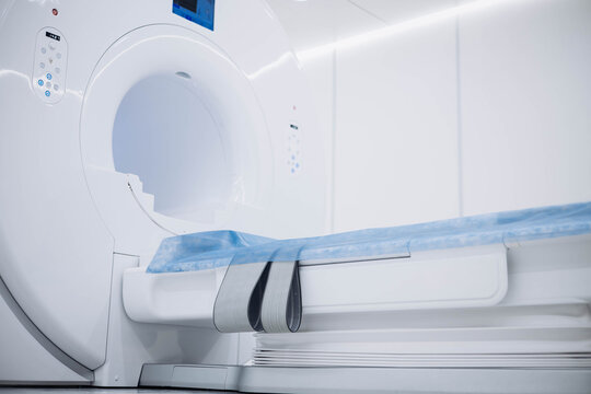 Medical CT or MRI Scan in the modern hospital laboratory. Interior of radiography department. Technologically advanced equipment in white room. Magnetic resonance diagnostics machine. Advertising