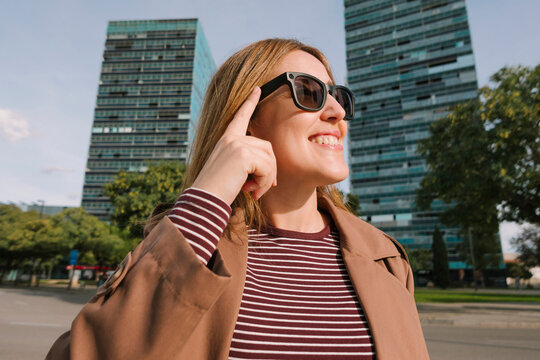 Woman controlling smart glasses 