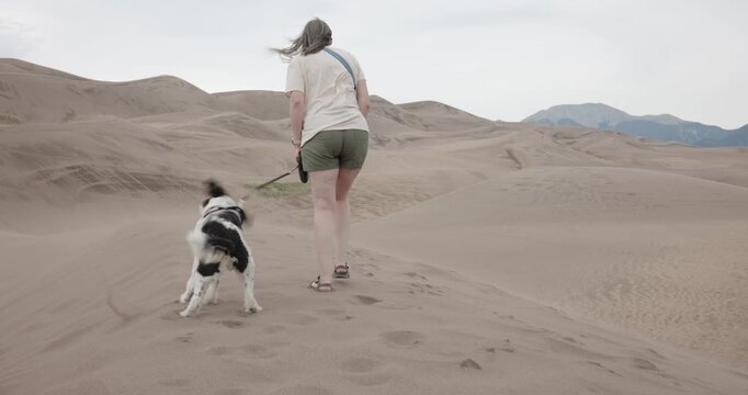Following Lady Walking her Aussiedoodle at the Great Sand Dunes