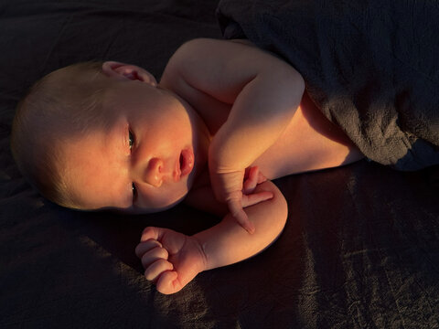 baby peacefully resting under warm light