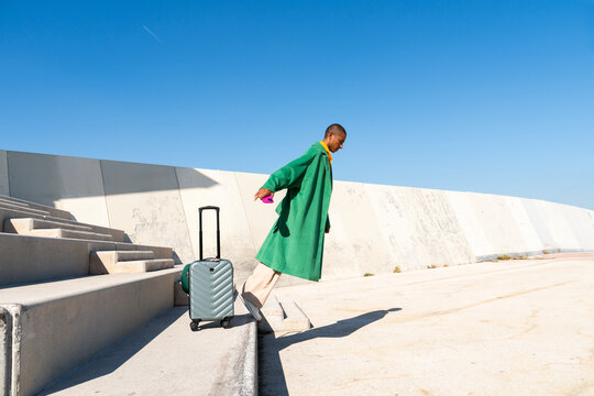 Man Running with Suitcase
