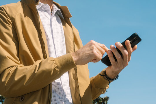 Man Using Mobile Phone Outdoors