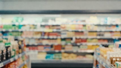 Fototapeta premium Grocery store with a lot of food on the shelves. The store is very busy and crowded