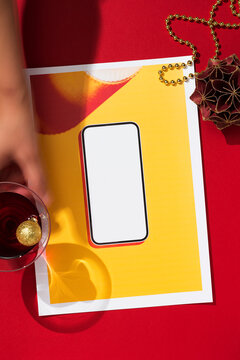 Xmas party concept with printed image of blank screen smartphone