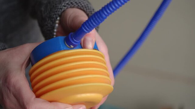 Manual Plastic Hand Pump Inflating with Hissing Air Sound Under Pressure