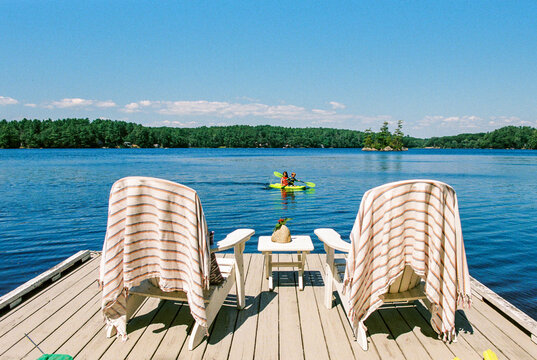 Summer vacation moment of kids on kayak in lake